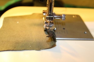 Hem the top of the pocket by doing a narrow hem.
