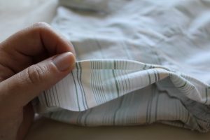 Turn under 1/4" on the sleeve edge.