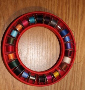 My bobbin holder with both plastic and metal bobbins