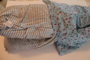 Stuff the pillow into the case
