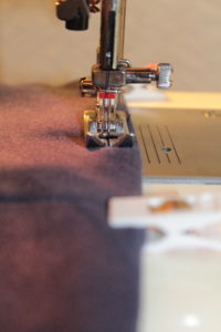Hem the polo with a double needle for a professional finished look