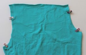Sewing the center front and back seams first.