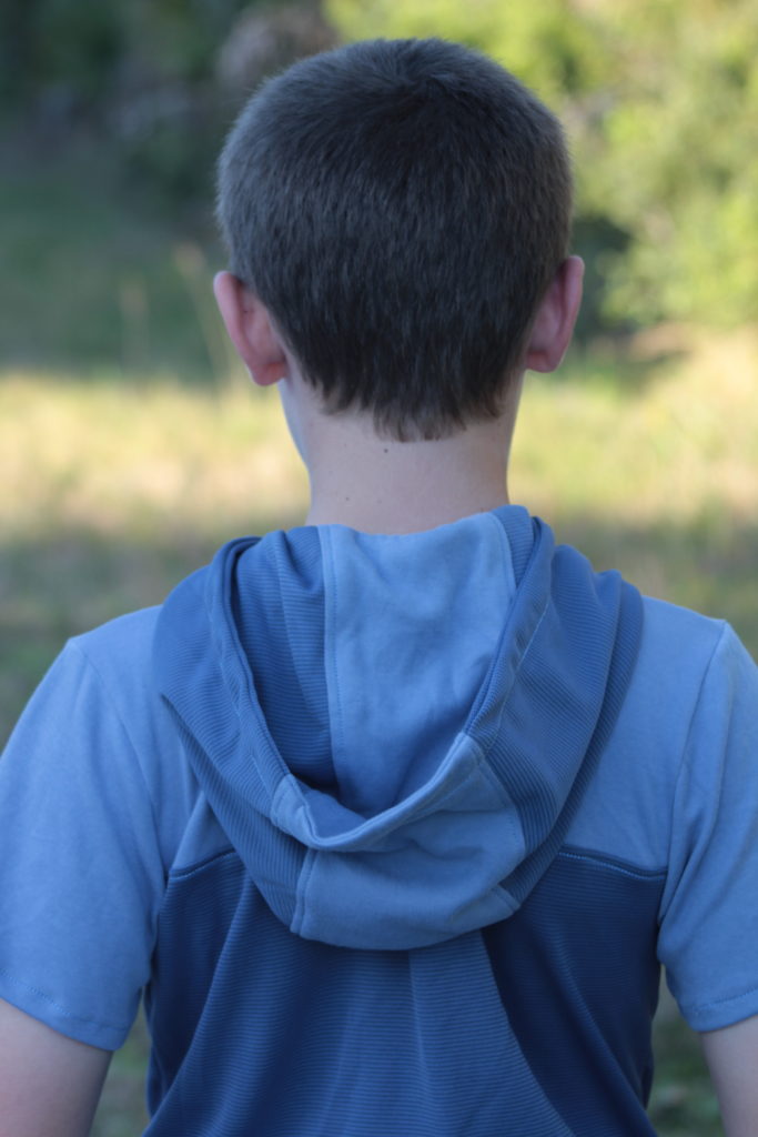 Hood is topstitched with a triple stretch stitch